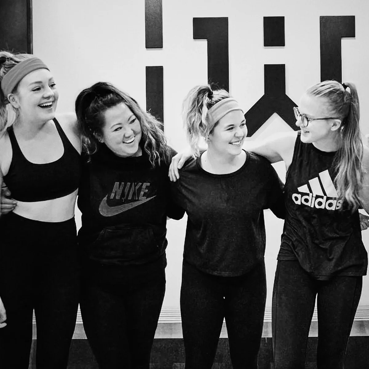 Wheelhouse riders laughing together after class